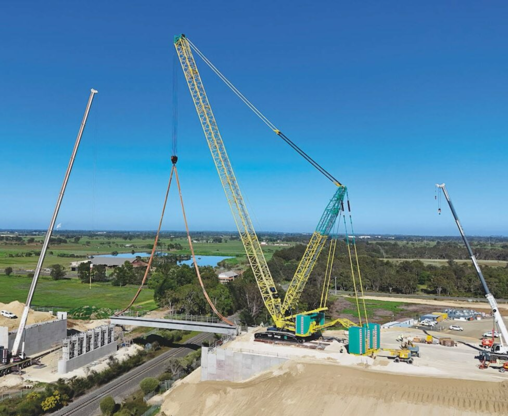 Tutt Bryant Crawler Crane installing bridge